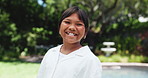 Happy, garden and face of child with smile outdoor for playing, relax and fresh air in neighborhood. Youth, childhood and portrait of girl in backyard for fun on holiday, vacation and weekend