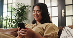 Phone, scrolling and typing with woman on sofa in living room of home for social media browsing. App, relax and text message with happy person in apartment for communication, me time or wellness