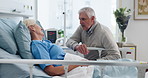 Couple, old man or senior woman in hospital bed for emotional support, compassion or conversation. Married, elderly people or visit in healthcare clinic for recovery update, kindness or communication