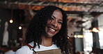 Face, happy woman and waitress in restaurant for customer service, pride and food industry professional. Portrait, confidence and server with smile for about us in bistro, hospitality and bokeh