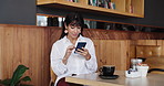 Business woman, phone and scroll in cafe for break, email notification and feedback. Freelance, copywriter and tech with internet for article, proofreading or review in coffee shop for proposal