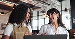 Women, waitress and talking in cafe with laptop for customer service review, planning and feedback. People, manager and employee in coffee shop with computer for hospitality, advice and discussion.