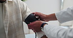 Blood pressure, check up and doctor with hands in clinic for medical exam, support and consulting. Healthcare, hospital and patient with equipment to monitor for heart rate, wellness and hypertension