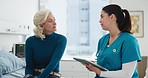 Senior woman, nurse and tablet with bad news for hospital, communication and discussion for healthcare. Elderly person, caregiver and technology for conversation with health, report and diagnosis