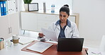 Doctor, woman and laptop with document for health insurance, medical aid or patient information. Healthcare worker, person and computer in office with paperwork for policy, planning or typing report.