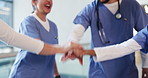 Applause, hand stack and healthcare with medical team in hospital for motivation or support. Clapping, huddle or success with doctors and nurses in hallway of clinic together for collaboration