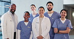 Happy, face and team of doctors and nurses in hospital with collaboration, diversity or medical support. Laugh, professional and portrait of healthcare employees in group with pride in clinic.