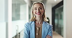 Face, happy woman or project manager with arms crossed in office, confident or corporate career in hallway. Portrait, quality assurance or director smile for opportunity, resource management or pride