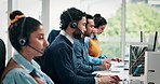 Call center, computer and man in workplace, talking and communication with system solution. Employees, help desk or people with coworking, consulting or contact us with discussion or customer service
