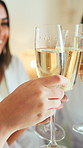 Cheers, happy and hands in hotel with champagne, bonding and congratulations on bachelorette trip. Friends, women and bridesmaid at resort with toast, sparkling wine or celebration at bridal shower.