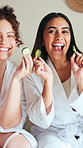 Face, friends and happy women with cucumber for skincare, dermatology or beauty in bedroom. Sleepover, people and organic products for facial treatment, hydration and pamper with portrait at home spa