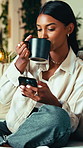 Coffee, phone and woman on sofa with contact, social media or connectivity on mobile app. Technology, relax and female person drinking warm beverage with cellphone for communication in apartment.