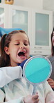 Advice, teeth and mirror with child at dentist office for oral hygiene, inspection and cleaning. Dental appointment, gum health and checkup with people for consulting, mouth and orthodontist