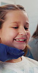 Inspection, consulting and smile with child at dentist office for oral hygiene, teeth whitening and cleaning. Dental appointment, gum health and checkup with people for advice and orthodontist