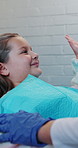 Smile, consulting and high five with child at dentist office for oral hygiene, teeth whitening and support. Dental appointment, success and checkup with people for helping, approval and orthodontist