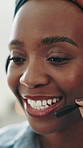 Smile, black woman and talk with mic at call centre for customer service, helping client and crm. Bokeh, female agent and consulting with online inquiry, virtual assistance and discussion for telecom