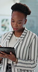 Black woman, tablet and typing at office with review, proposal or risk assessment at company. African person, tech and broker on application for feedback with online consulting at insurance agency