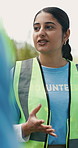 Outdoor, volunteer and woman talking in meeting for community service, non profit or coordination. Park, charity worker and planning with NGO instructions, organizing outreach and feedback with team