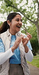 Happy, woman and volunteer with applause in park for good news with charity success. Smile, person and clapping hands for community service goals, fundraising achievement and team motivation outdoor