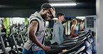 Man, tired and running on treadmill, gym or workout routine for muscle strength, sweating and cardio. People, athletes and together on machine for exercise, exhausted and breathing in health club