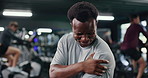 Athlete, man and ache with arm pain at gym for fitness injury, muscle strain and discomfort. Male person, cramps and joint inflammation from workout accident, exercise mistake and fibromyalgia sprain