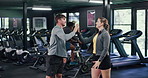 Personal trainer, high five and team in gym for fitness, workout and exercise motivation together. Man, woman and people with success for sports, training and wellness or body goals in health club
