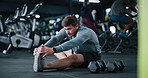 Man, fitness and stretching with preparation in gym for workout, exercise or indoor training. Active, male person or getting ready with body warm up for flexibility or muscle recovery in health club