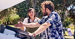 Frustrated couple, car trouble and argument with fight for road side assistance or breakdown. Angry, man and woman with conflict, disagreement or dispute for vehicle problem, fix or outdoor road trip