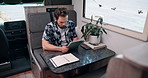 Freelancer, tablet and typing with man in van for digital nomad, travel blog and research. Remote worker, holiday journey review and rv campervan guide with person and tech in vehicle for transport