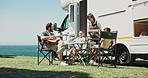 Family, picnic and happy by ocean, motorhome or relax with guitar, space and music for bonding with kids. People, parents and children with rv, food and singing by sea with on summer vacation
