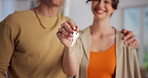 New home, love and hands of couple with keys for moving in, property purchase and relocation. Homeowner, happy and man with woman hug with keychain for house, real estate and mortgage for commitment