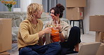 Couple, toast champagne and new home with celebration, moving and boxes on floor at property. Happy woman, man and excited with sparkling wine, achievement and relocation with real estate investment