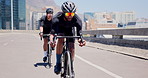 Cycling, fitness and men on bicycle in city for sports, training and exercise for endurance outdoor. Town, team and people on bike for competition, race and challenge for workout, wellness or health