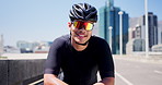 Man, bicycle and sunglasses with smile in city for fitness, confidence and outdoor on urban bridge. Person, happy and helmet with space in street for exercise, wellness or cardio training in town