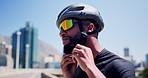 Athlete, man and fasten helmet in city for cycling safety, triathlon exercise and getting ready. Photochromic lenses, cyclist and headgear preparation for ride protection, fitness and sports workout