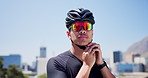Man, helmet and start cycling in city, sunglasses and outdoor for training, fitness or ready in street. Person, smile and safety gear for ride, exercise or cyclist with space on bridge in urban town
