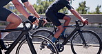 Sports, cycling and people on bicycle in city for fitness, training and exercise together for endurance. Town, athlete and men for competition, race and challenge for workout, wellness and health