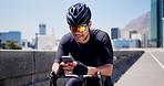 Cycling, typing and man in city with phone, message or social media scroll on workout break. Fitness, sportswear and cyclist on bridge with tech, wellness chat or internet browse in energy recovery.