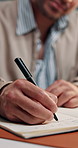 Businessman, hands and writing with diary for reminder, schedule or to do list in office. Closeup, man or journalist with book, notebook or checklist for business plan, tasks or agenda in workplace