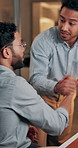 Men, discussion and high five with mentor, office and happy for software development or working late. Excited, IT manager and celebration for success, team and shaking hands with programmer at night
