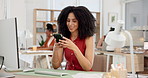 Creative, woman and typing with phone in office for research, contact source and copywriting. Smile, person or coworking with mobile for feedback, confirm interview and texting for publication agenda