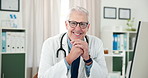 Doctor, mature man and confidence with face in office with paperwork for medical admin or online consulting. Person, medicine expert and portrait in clinic with smile, technology and healthcare