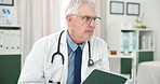 Doctor, man and thinking in office with tablet for health insurance, patient report and research. Healthcare worker, mature person or reading in clinic with tech, medical aid policy or contemplation.
