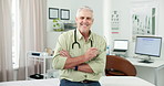 Doctor, man and arms crossed with face in office with confidence for medical admin or online consulting. Mature person, medicine expert and portrait in clinic with smile, technology and healthcare