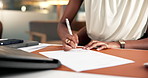 Hand, paper and signature with business woman at desk in office for accounting or finance report. Approval, documents and pen with professional employee in financial workplace for review of contract