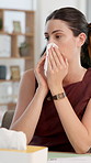 Sick woman, typing or blowing nose with tissue in office for illness, disease or virus. Female person, sneeze or mucus with hayfever, infection or sinus for allergy season or influenza in workplace