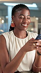 Mobile, typing and happy black woman in office for business, event planning and funny email at night. Phone, person and coordinator in workplace to text venue update, meme or feedback in evening