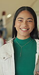 Face, girl and teen in high school with smile, knowledge or scholarship for academic development. Education, gen z and student in hallway with confidence, pride and growth in learning opportunity.