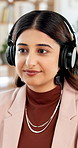 Media agency, headphones and woman in office, dancing and listening to music, motivation and energy. Person, journalist and employee in workplace, sound and audio with playlist album and radio song