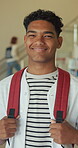 Face, teenager or boy with smile in high school for education development, pride or ready for learning. Portrait, happy and student with confidence for knowledge growth, academy corridor and backpack